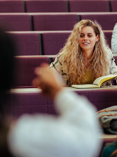 University students seated in a classroom facing an instructor