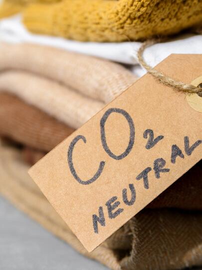 Stack of fabrics with tag stating "CO2 NEUTRAL"