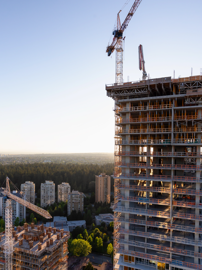 High-rise under construction rising above cityscape