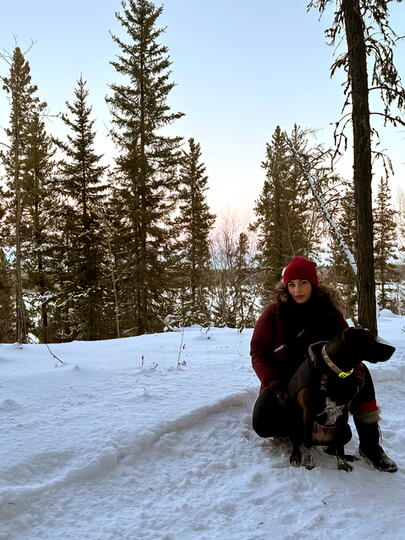 Rohma Khurram Nawaz with her dog Saiya on a snowy day