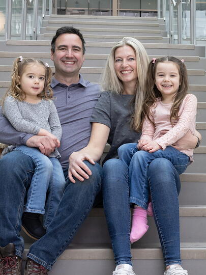 Portrait of James Seabrook and his family seated on a set of stairs