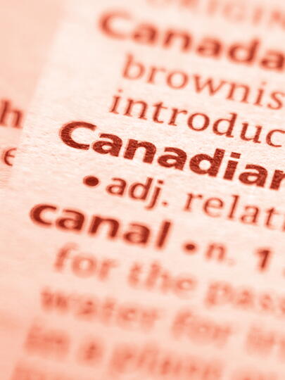 Close-up of "Canadian" entry in dictionary, with red overlay