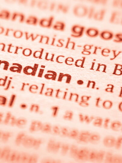 Close-up of "Canadian" entry in dictionary, with red overlay